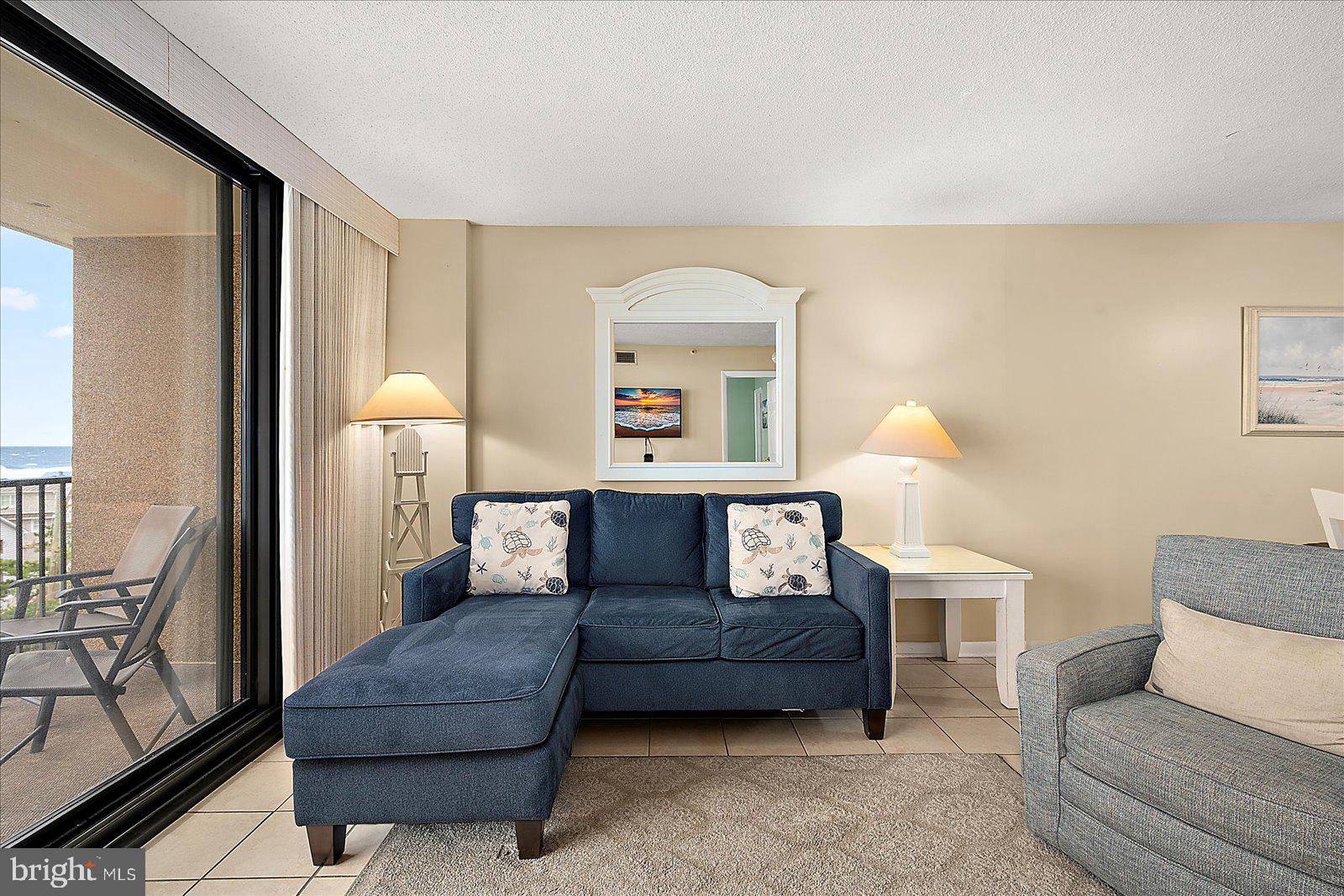 502 Island House Road Bethany Beach, DE 19930 - Photo 10 of 56 a living room with furniture and a fireplace