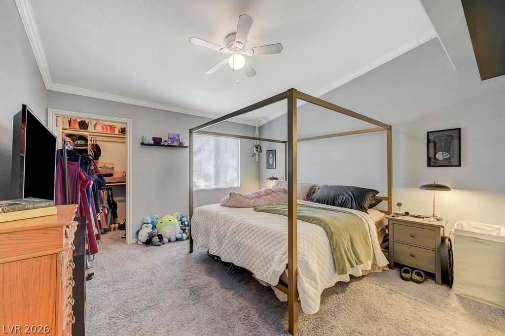 7885 West Flamingo Road, Unit 1079 Las Vegas, NV 89147 - Photo 18 of 35 This inviting bedroom features vaulted ceilings and ample closet space, creating a comfortable and spacious retreat.