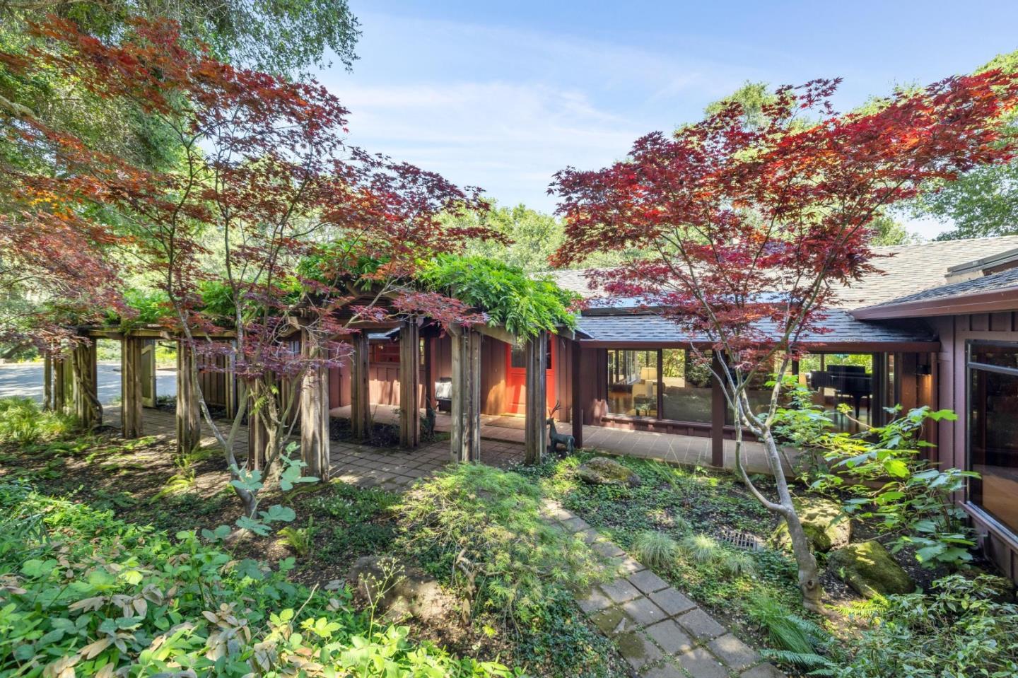 a front view of a house with garden