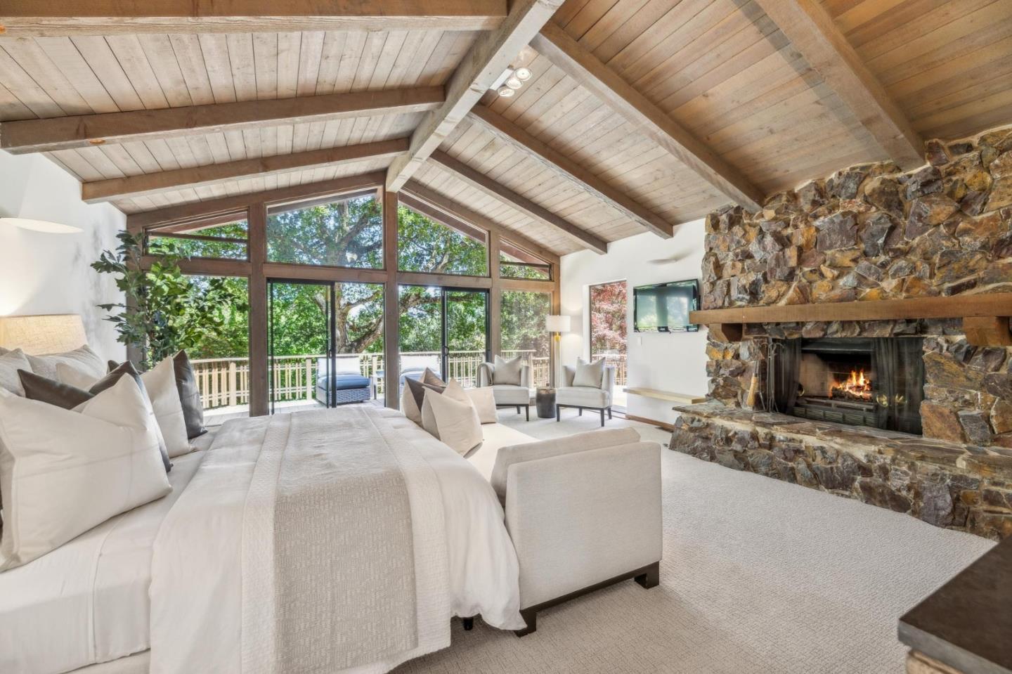 19 Preston Road Woodside, CA 94062 - Photo 8 of 30 a large bedroom with furniture fireplace and a large window