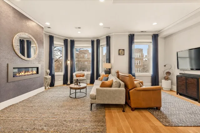 a view of a chairs and tables in the back yard of the house