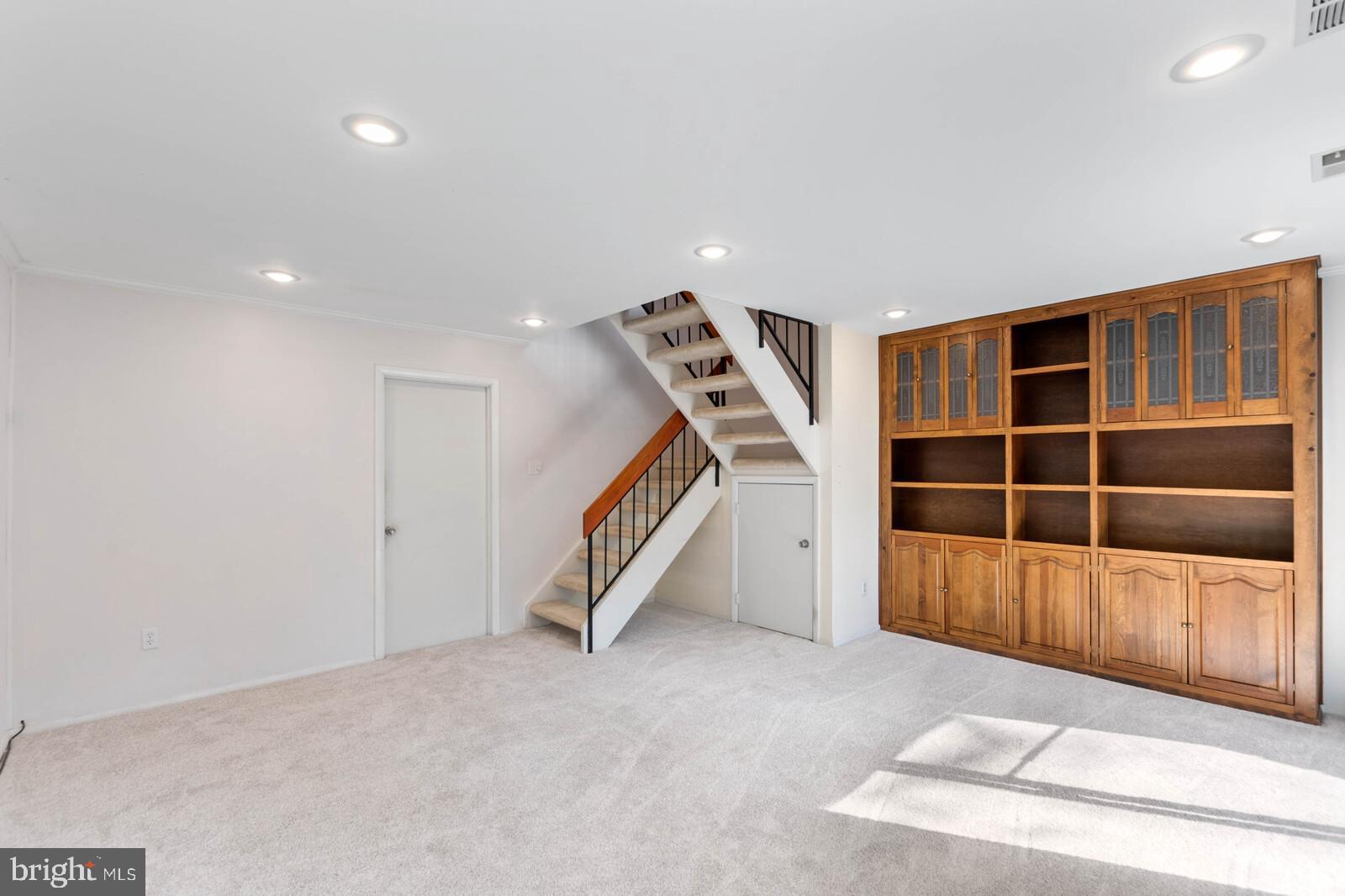 2222 White Cornus Lane Reston, VA 20191 - Photo 22 of 29 Lower Level Family Room Walkout with Built In