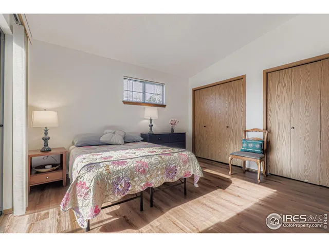 a bedroom with a bed and a table