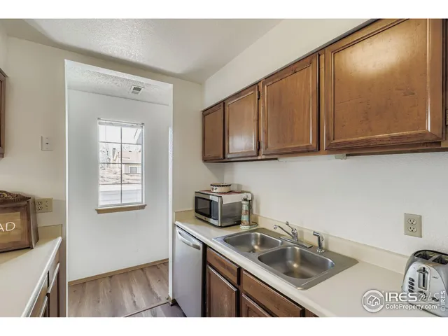 a kitchen with sink cabinets and microwave