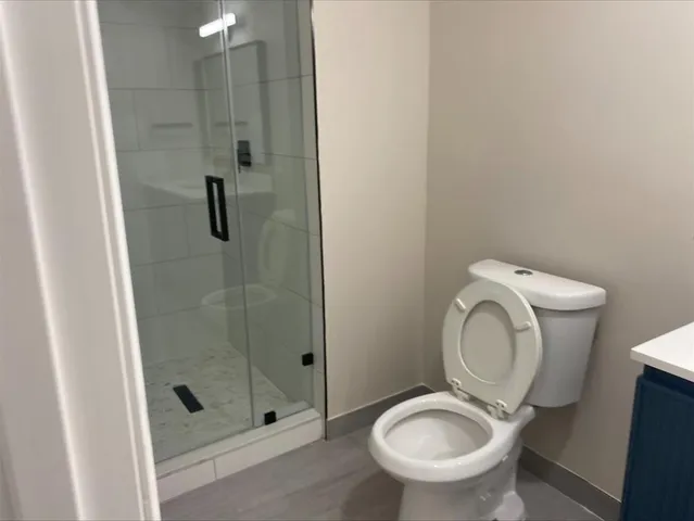 a bathroom with a toilet and a sink