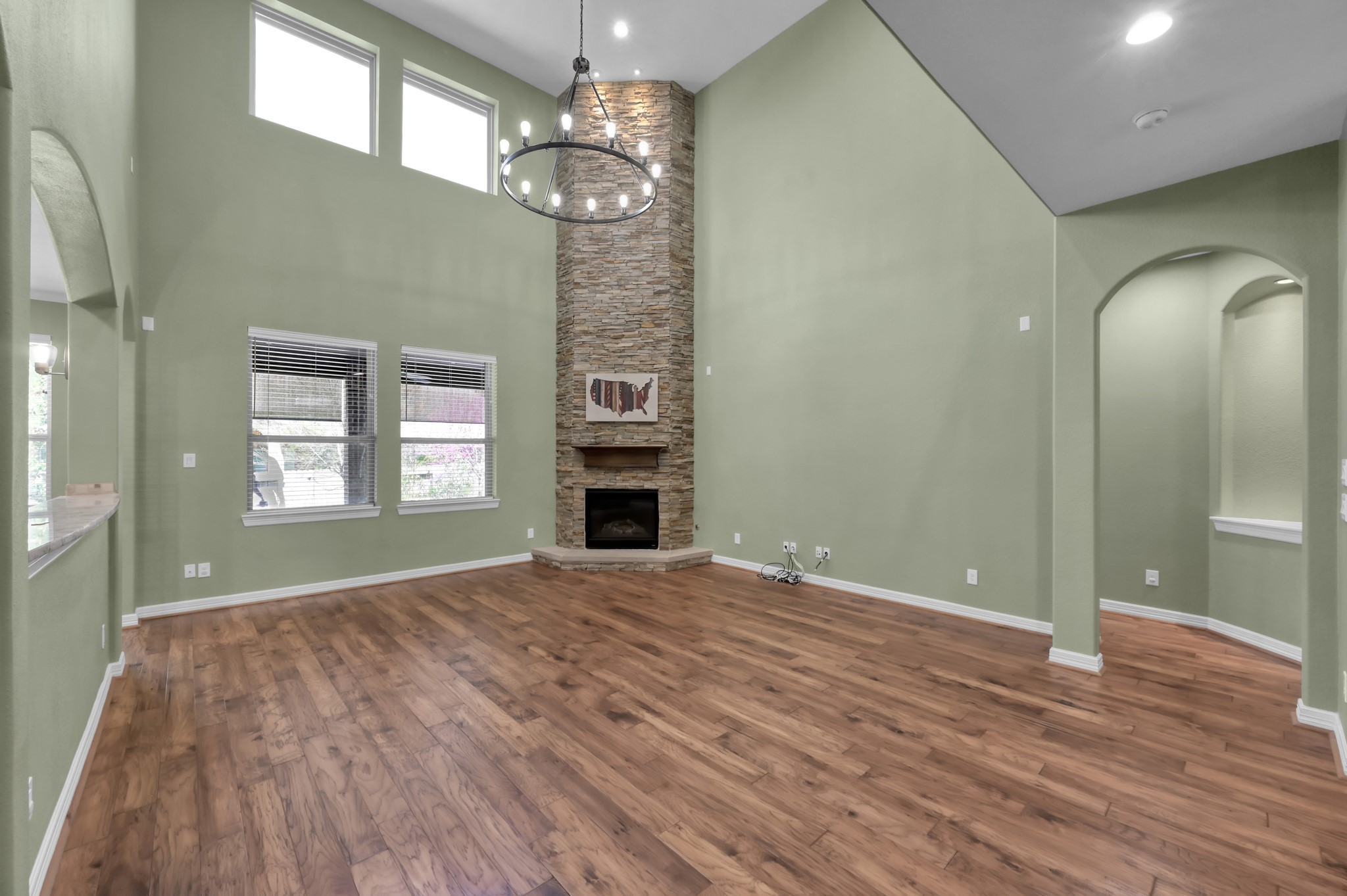 23219 Belted Kingfisher Trail Spring, TX 77389 - Photo 9 of 43 Floor-to-ceiling stone fireplace serves as a stunning focal point, adding warmth and character.