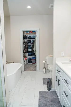 a bathroom with a bathtub sink and toilet