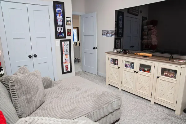 a bed room with a bed and a book shelf