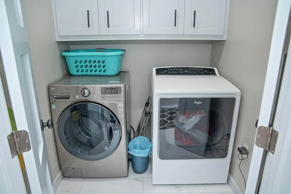 a utility room with dryer and washer