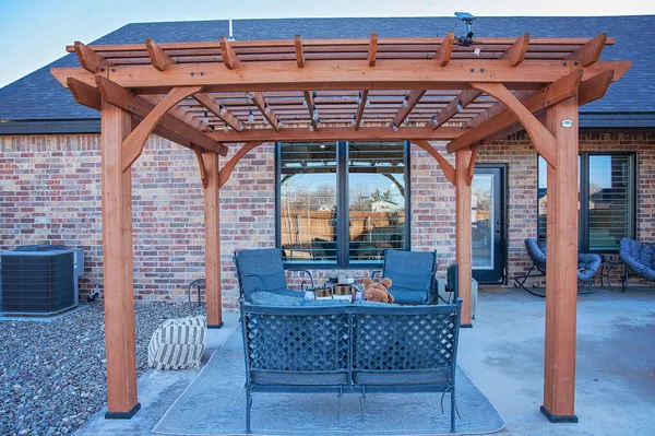 a outdoor living space with furniture hardwood and a fireplace