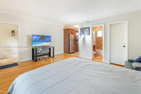 a bed room with a bed and a chair