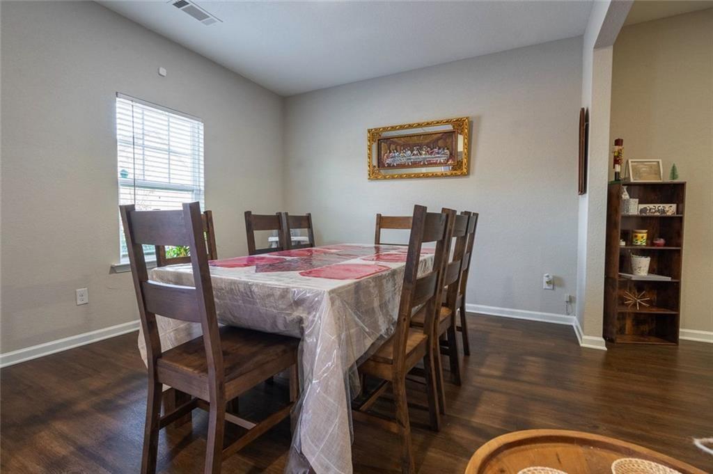 735 Walnut Creek Circle Pendergrass, GA 30567 - Photo 4 of 29 a dining room with furniture and wooden floor