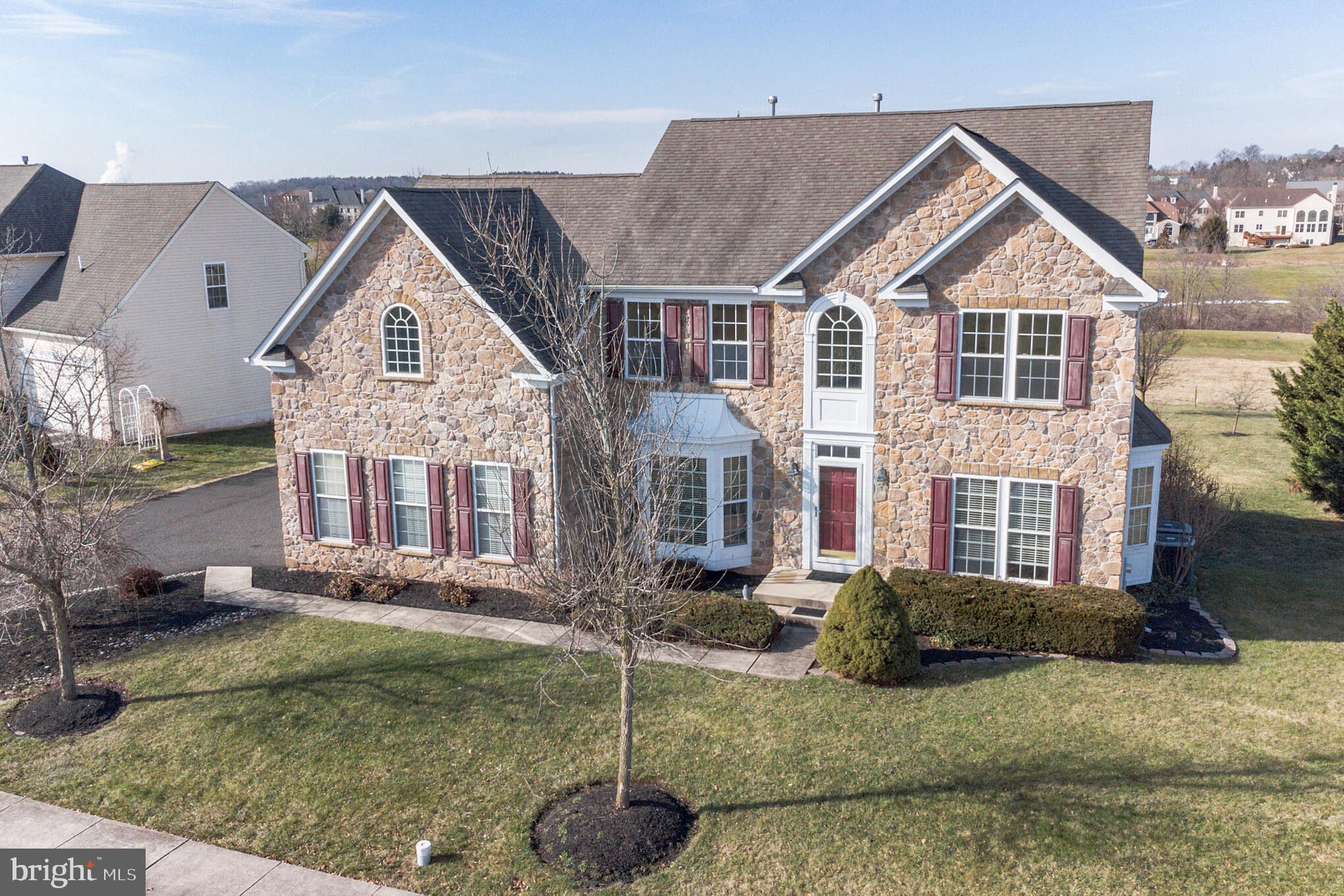 929 Clubhouse Drive Harleysville, PA 19438 - Photo 1 of 41 a front view of a house with a yard