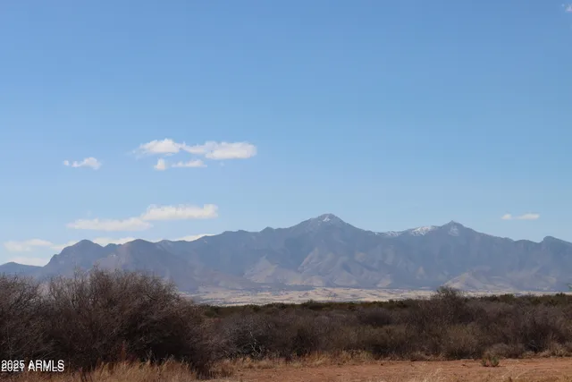 a view of a town with mountains in the background