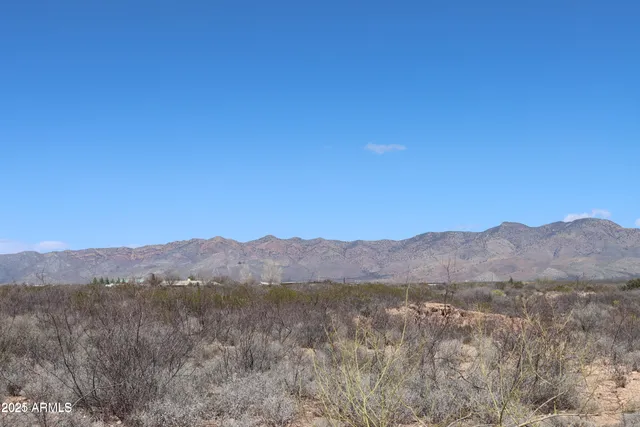 a view of a town with mountains in the background