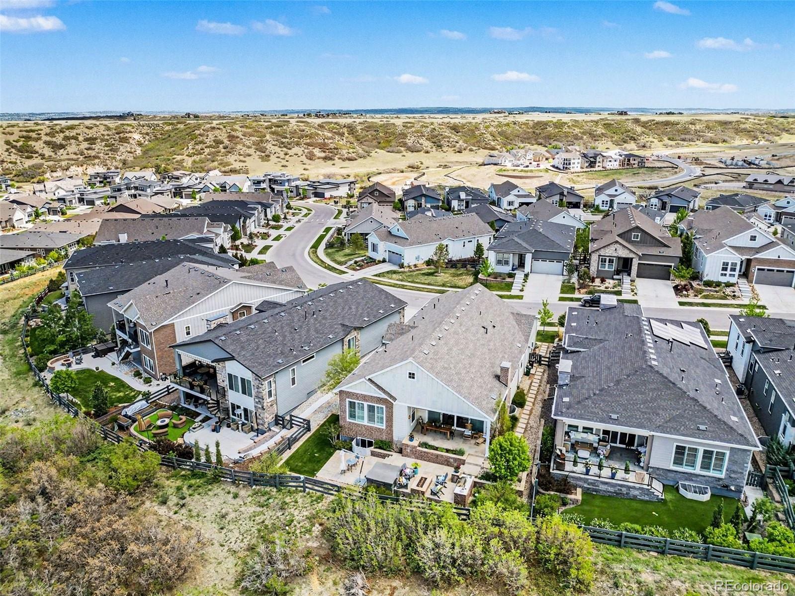 2101 Rim Ridge Drive Castle Pines, CO 80108 - Photo 40 of 50 an aerial view of residential building with outdoor space and ocean