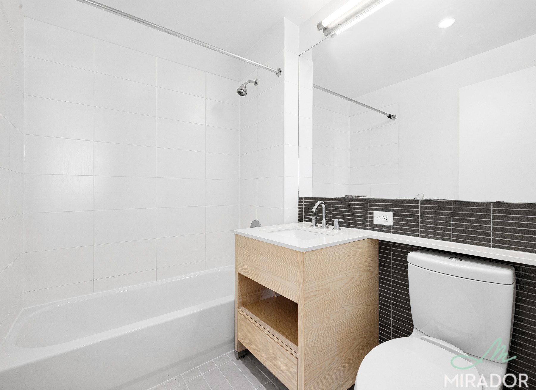 80 Dekalb Avenue, Unit 23D Brooklyn, NY 11201 - Photo 6 of 18 a bathroom with a sink a toilet and shower