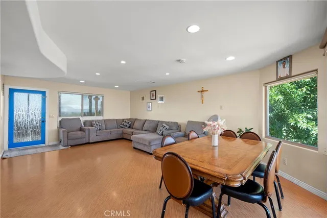 a view of a dining room with furniture window and outside view