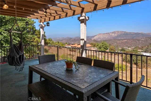 a kitchen with kitchen island granite countertop a stove and a sink