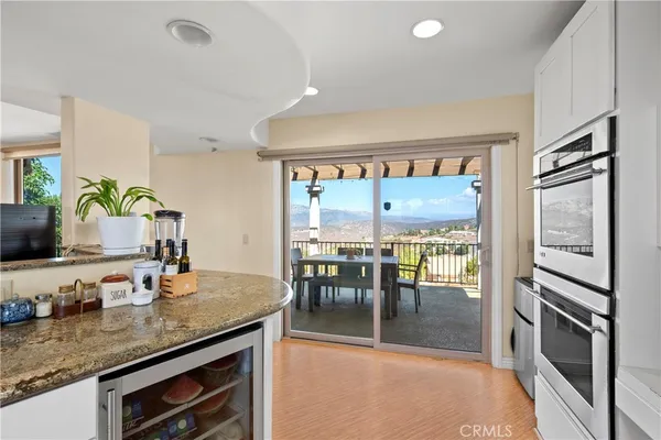a kitchen with stainless steel appliances granite countertop a refrigerator stove and oven