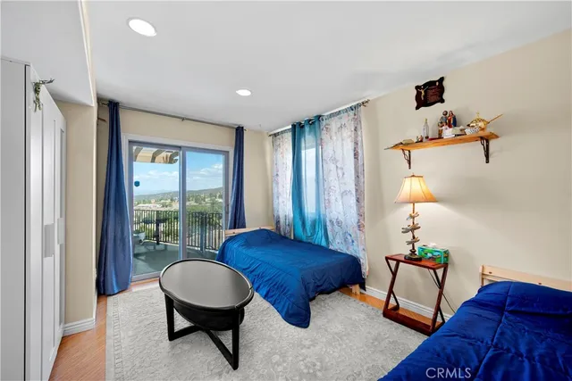 a bathroom with a bathtub shower sink mirror vanity and toilet
