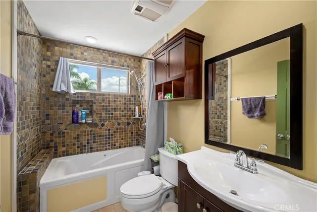 a spacious bedroom with a bed and large windows