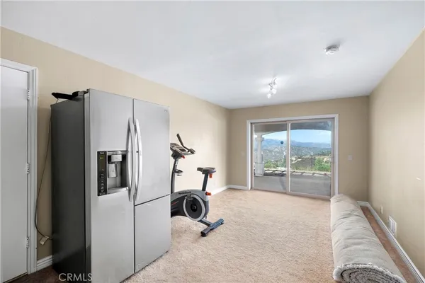a kitchen with a refrigerator and a sink