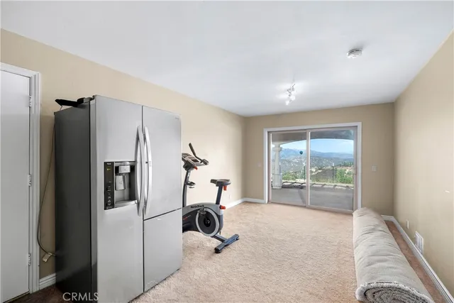 a kitchen with a refrigerator and a sink