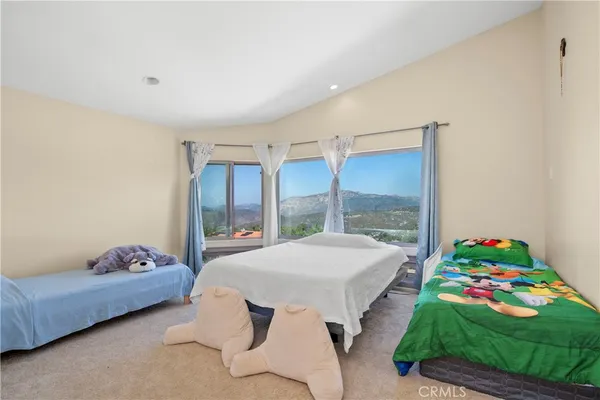 a bathroom with sink a mirror a bathtub and shower