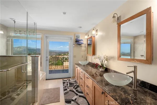 a bathroom with a bathtub and a shower