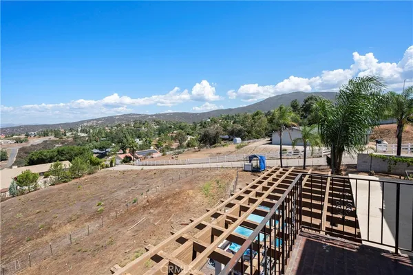 a view of a patio with table and chairs