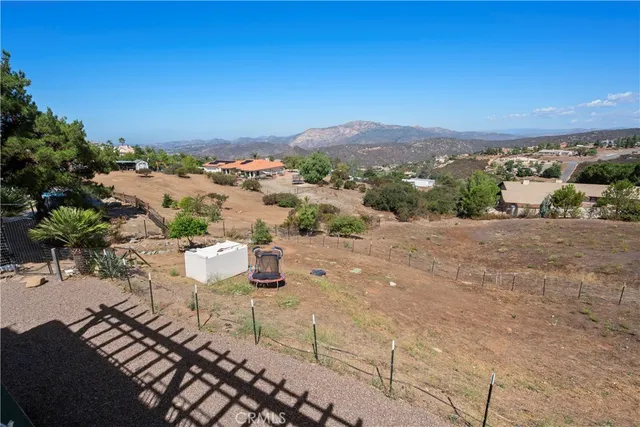 a view of a swimming pool with lawn chairs