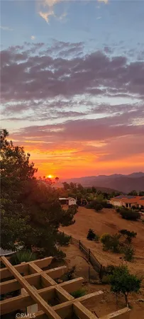 a view of balcony with a yard and mountain view