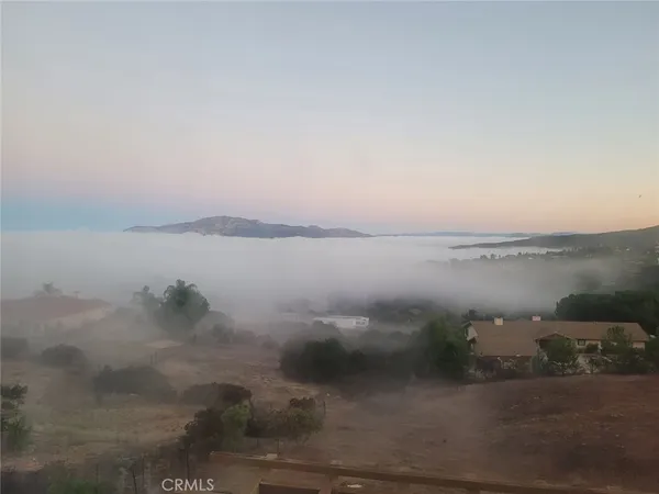 an aerial view of residential house and green space