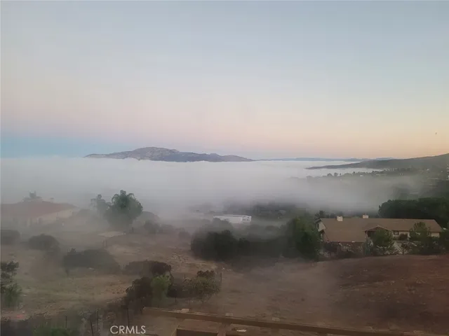 an aerial view of residential house and green space