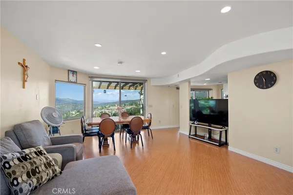 a view of a dining room with furniture and window