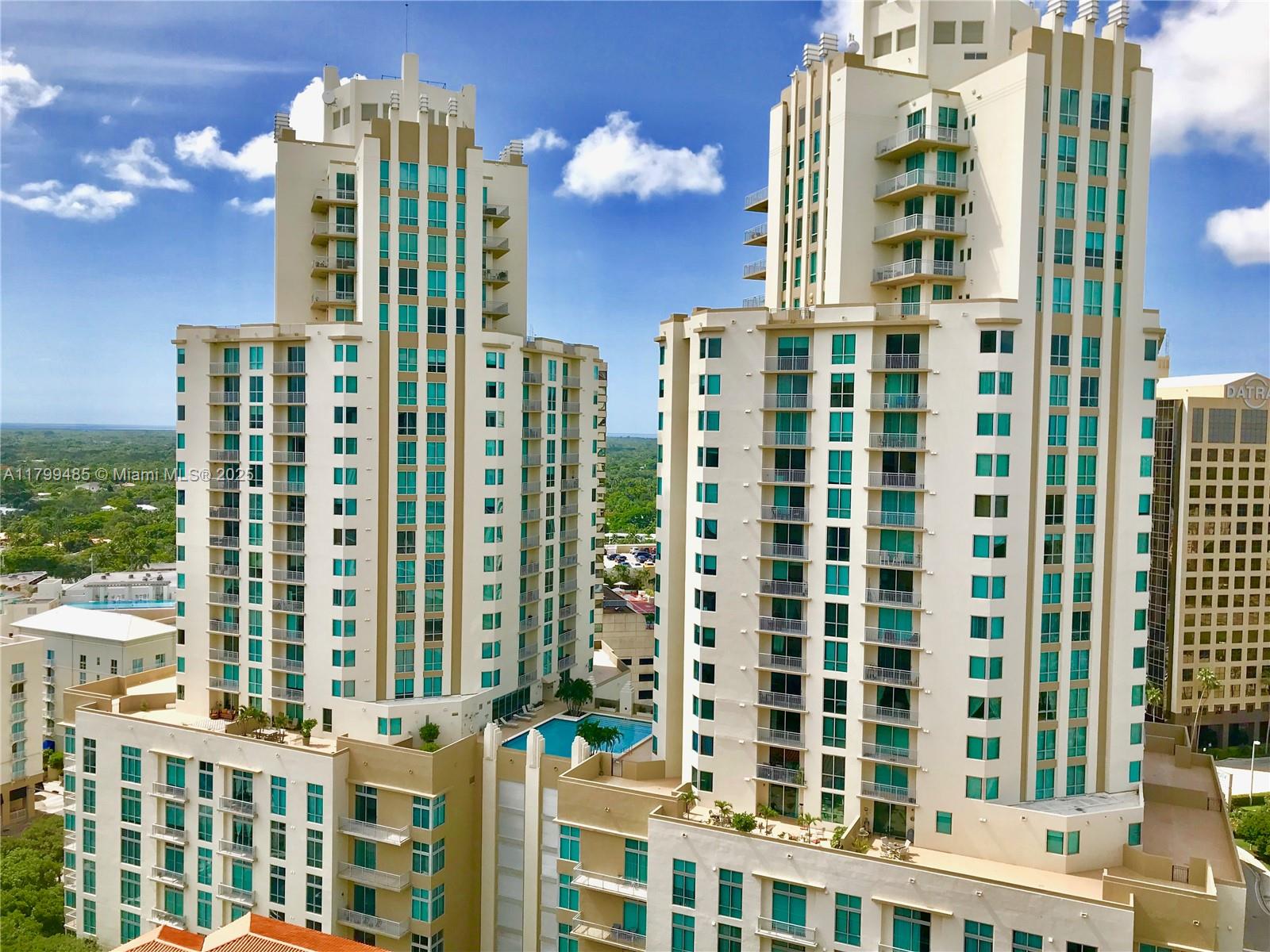 9066 Southwest 73rd Court, Unit 1504 Miami, FL 33156 - Photo 13 of 19 a front view of a building with a street