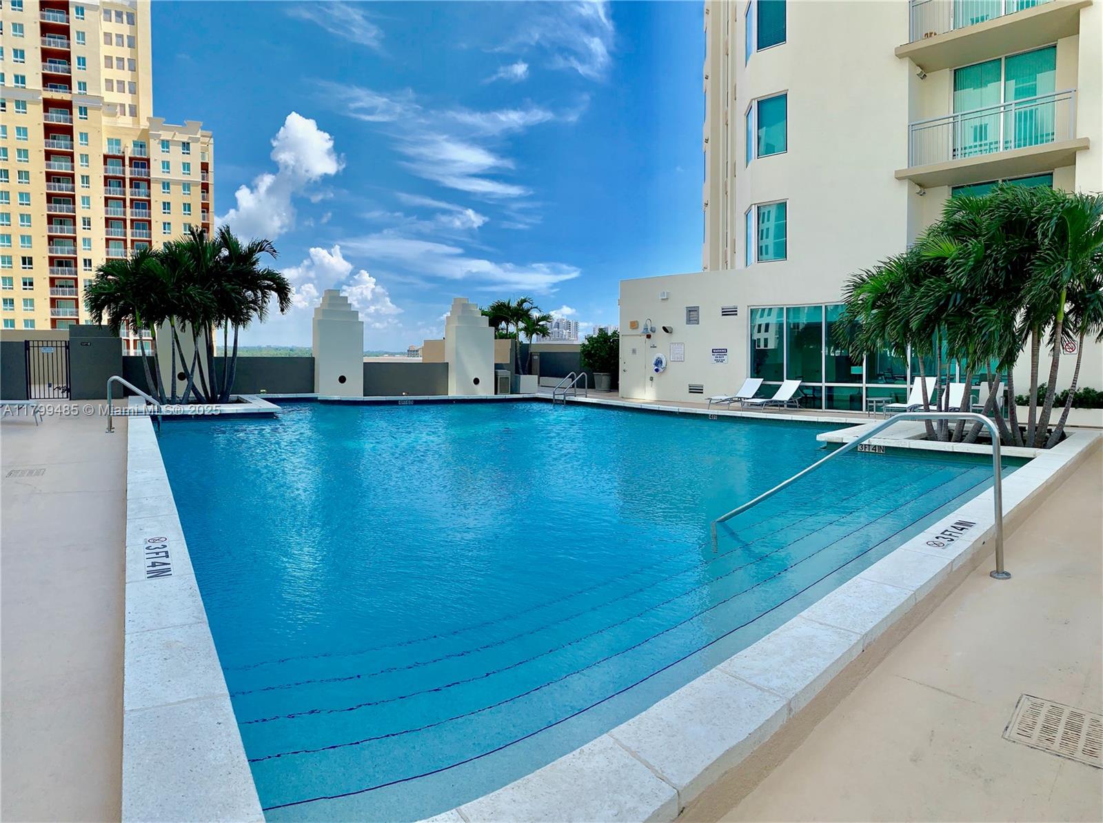9066 Southwest 73rd Court, Unit 1504 Miami, FL 33156 - Photo 16 of 19 a view of a swimming pool with outdoor seating