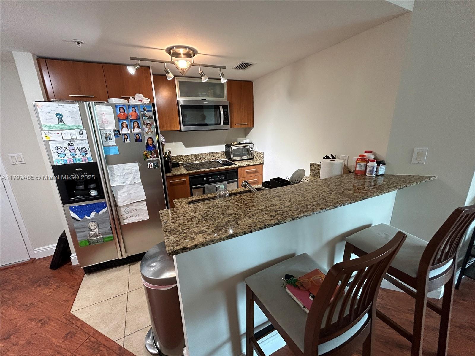 9066 Southwest 73rd Court, Unit 1504 Miami, FL 33156 - Photo 6 of 19 a kitchen with sink and cabinets