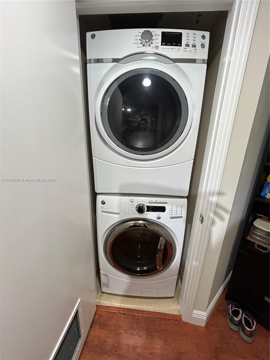 9066 Southwest 73rd Court, Unit 1504 Miami, FL 33156 - Photo 9 of 19 a utility room with dryer and washer