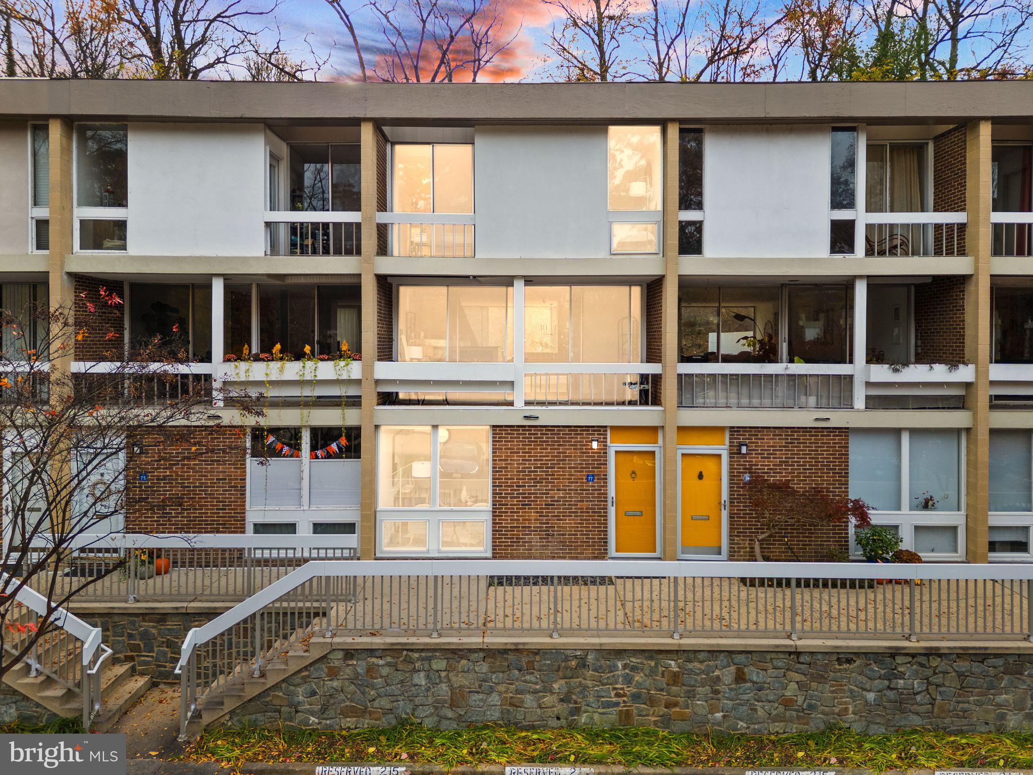 11577 Maple Ridge Road Reston, VA 20190 - Photo 1 of 48 a front view of a house with swimming pool