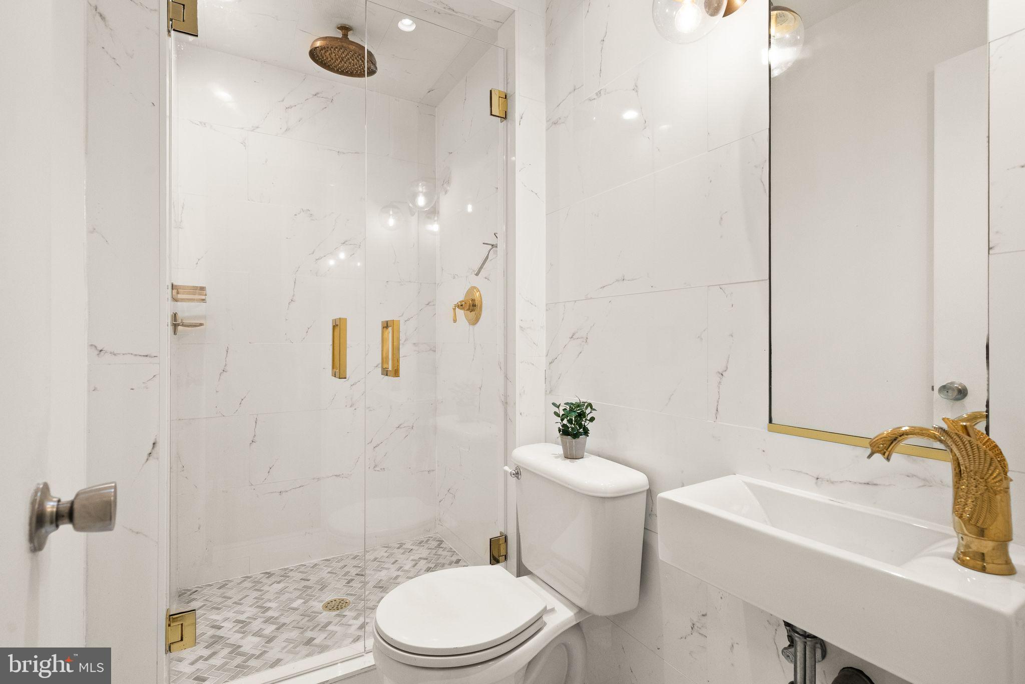 11577 Maple Ridge Road Reston, VA 20190 - Photo 14 of 48 a bathroom with a sink toilet and shower