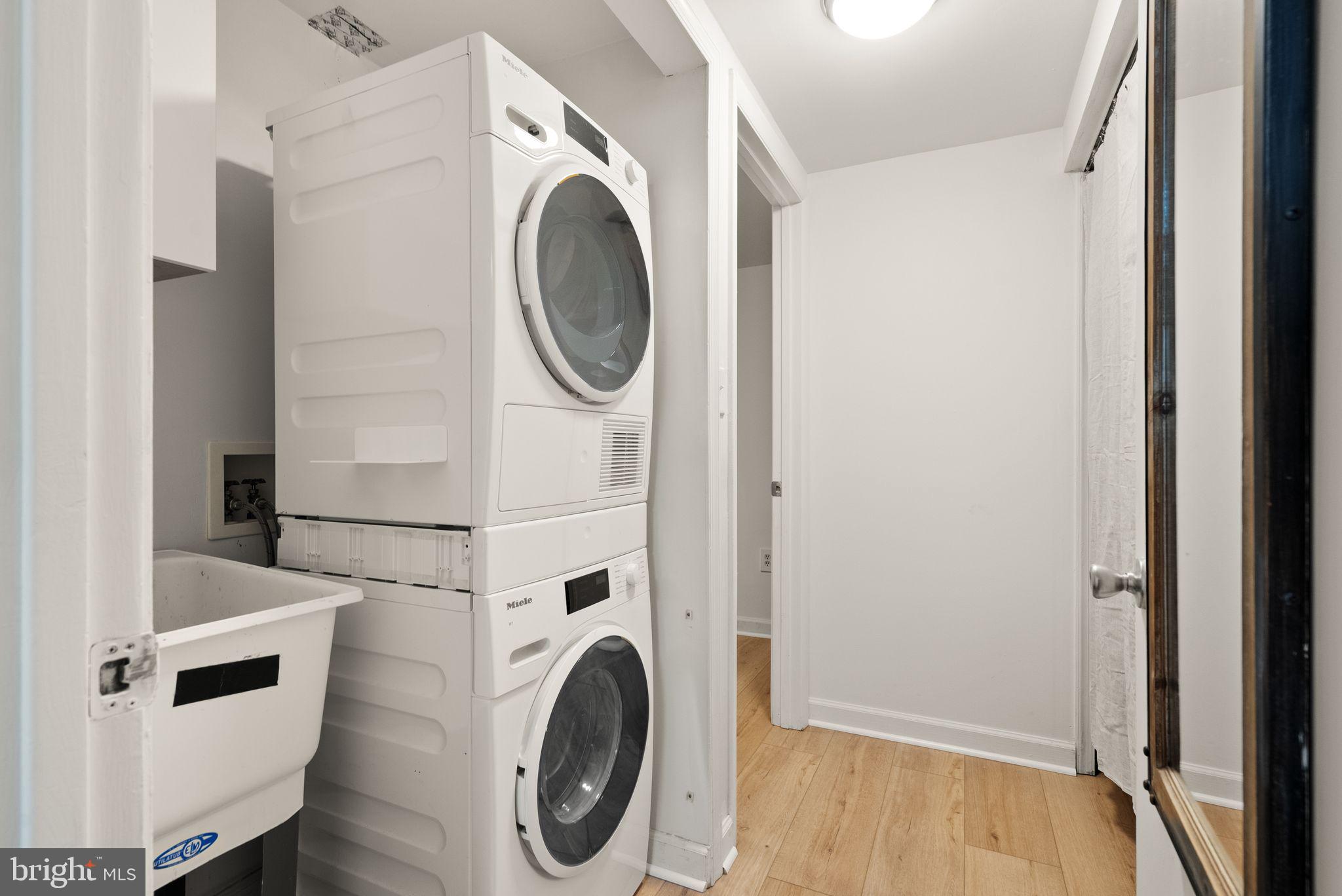 11577 Maple Ridge Road Reston, VA 20190 - Photo 15 of 48 a utility room with dryer and washer