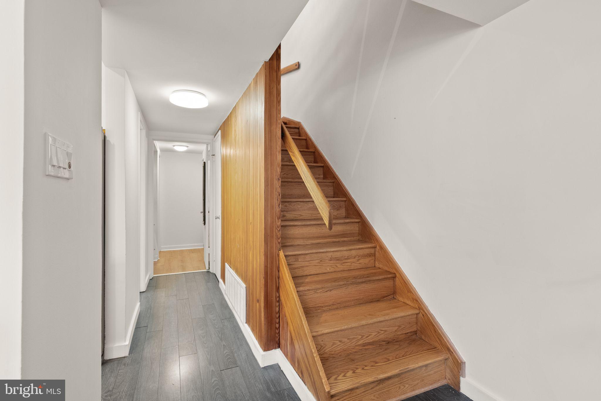 11577 Maple Ridge Road Reston, VA 20190 - Photo 16 of 48 a view of a hallway with wooden floor and entryway