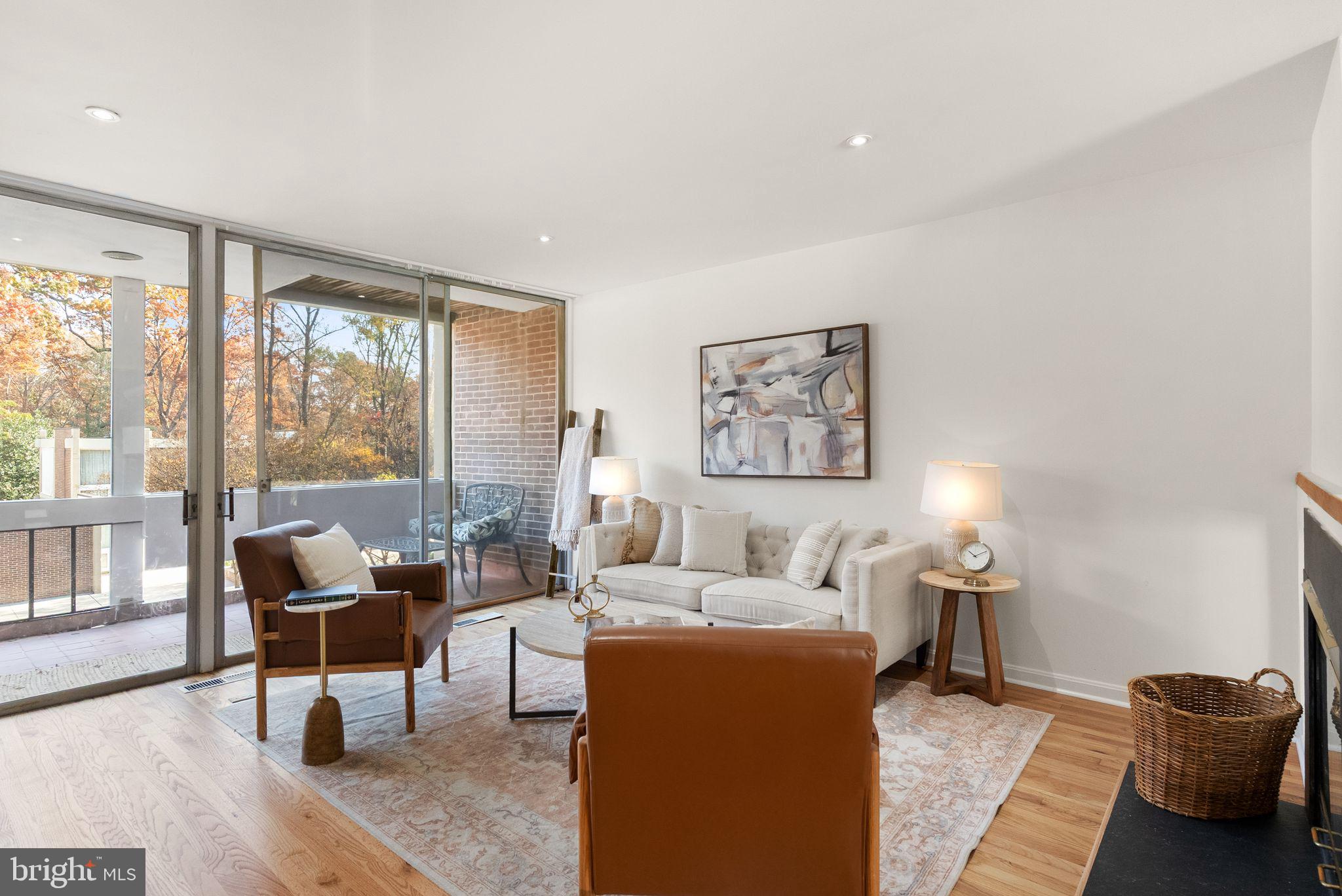 11577 Maple Ridge Road Reston, VA 20190 - Photo 17 of 48 a living room with furniture and a large window