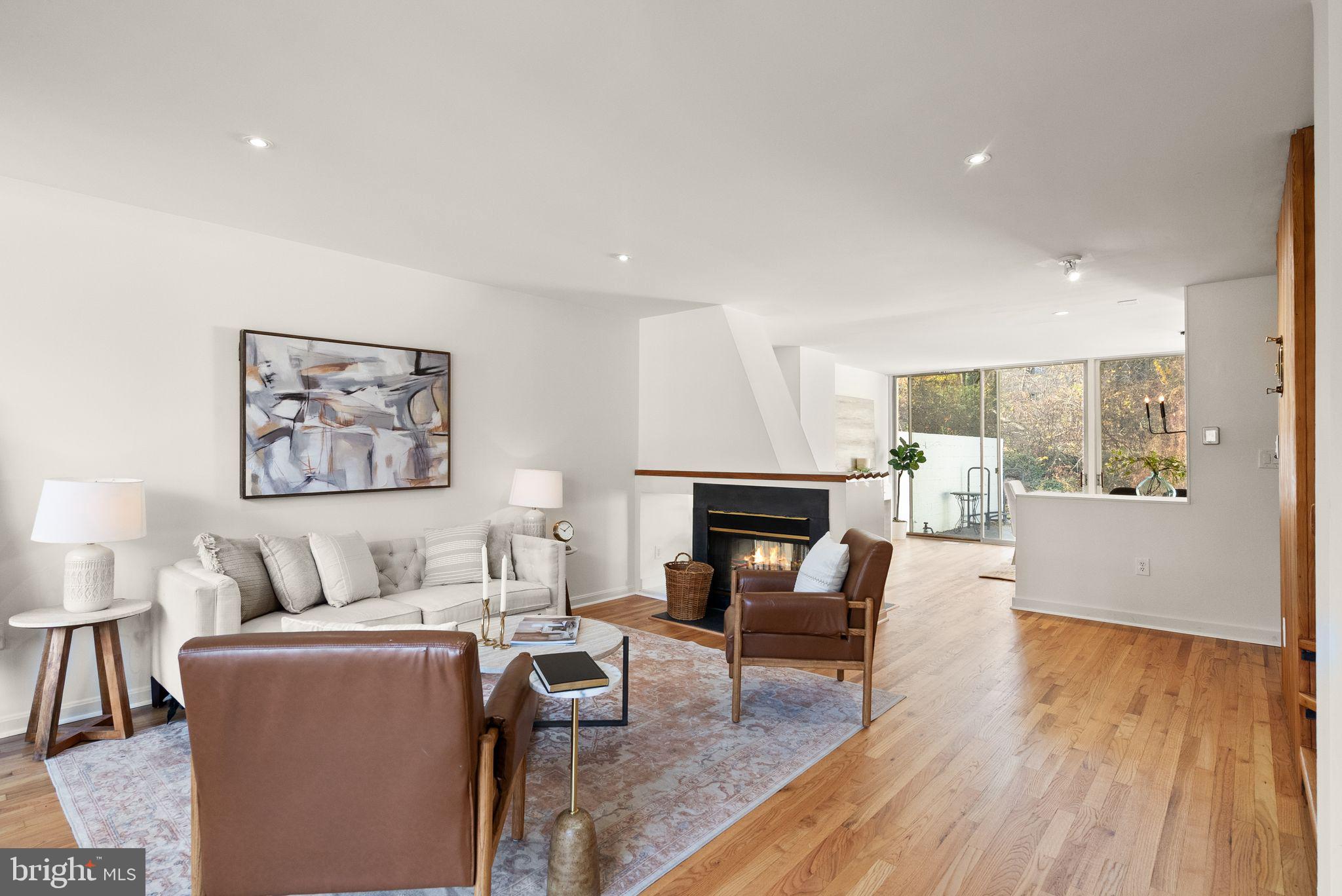 11577 Maple Ridge Road Reston, VA 20190 - Photo 18 of 48 a living room with furniture and a fireplace