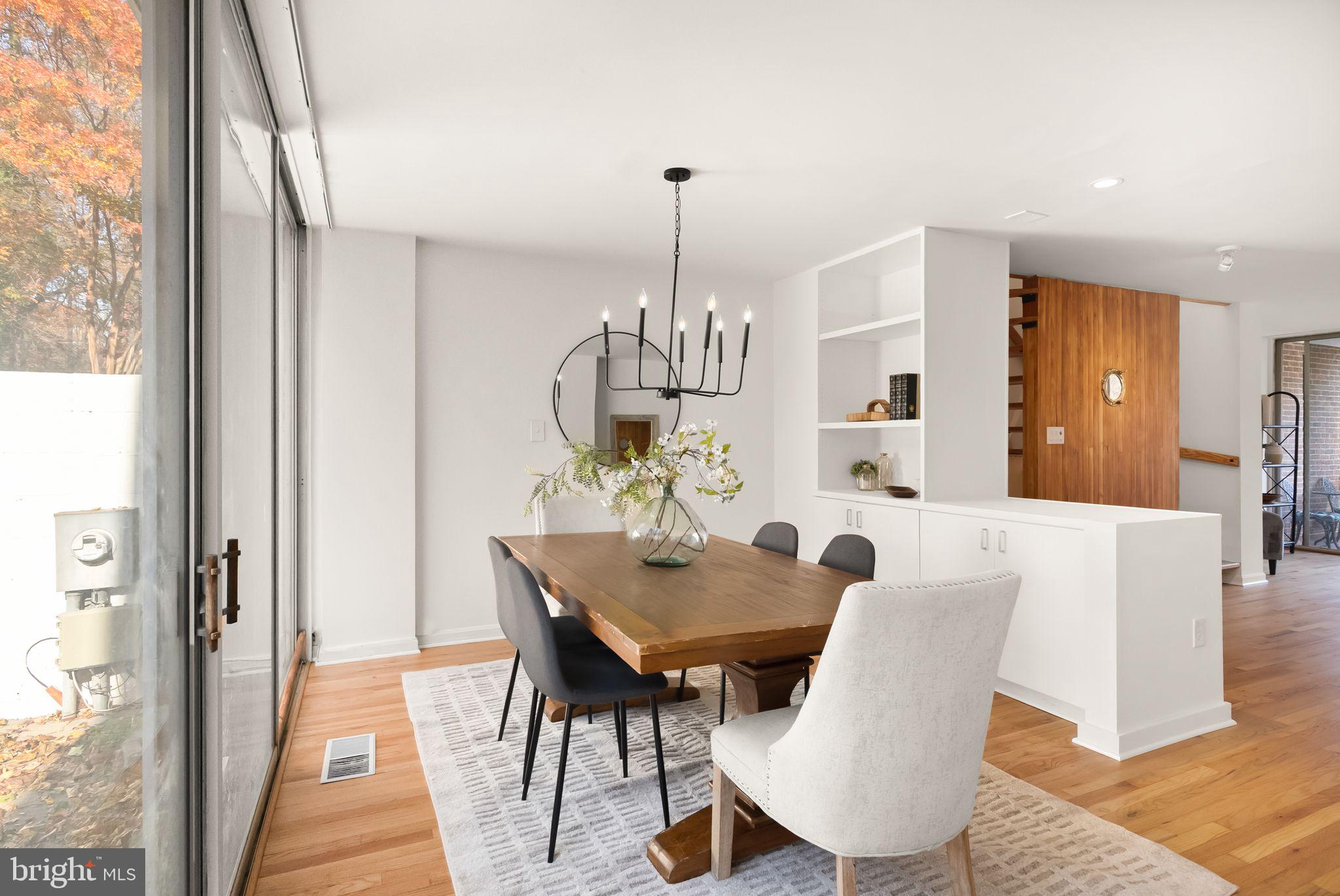 11577 Maple Ridge Road Reston, VA 20190 - Photo 26 of 48 a view of a dining room with furniture window and wooden floor