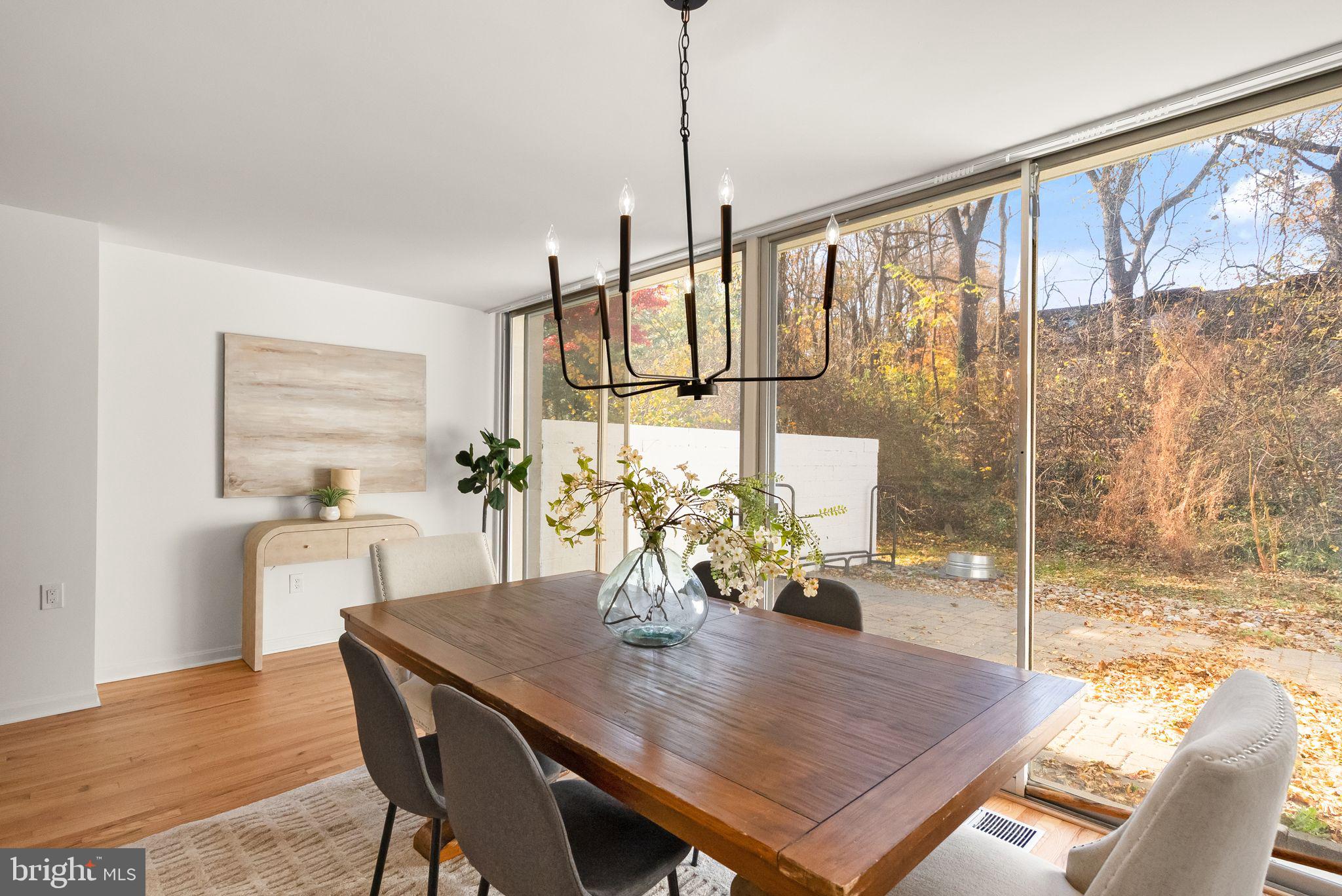 11577 Maple Ridge Road Reston, VA 20190 - Photo 27 of 48 a view of a dining room with furniture and wooden floor