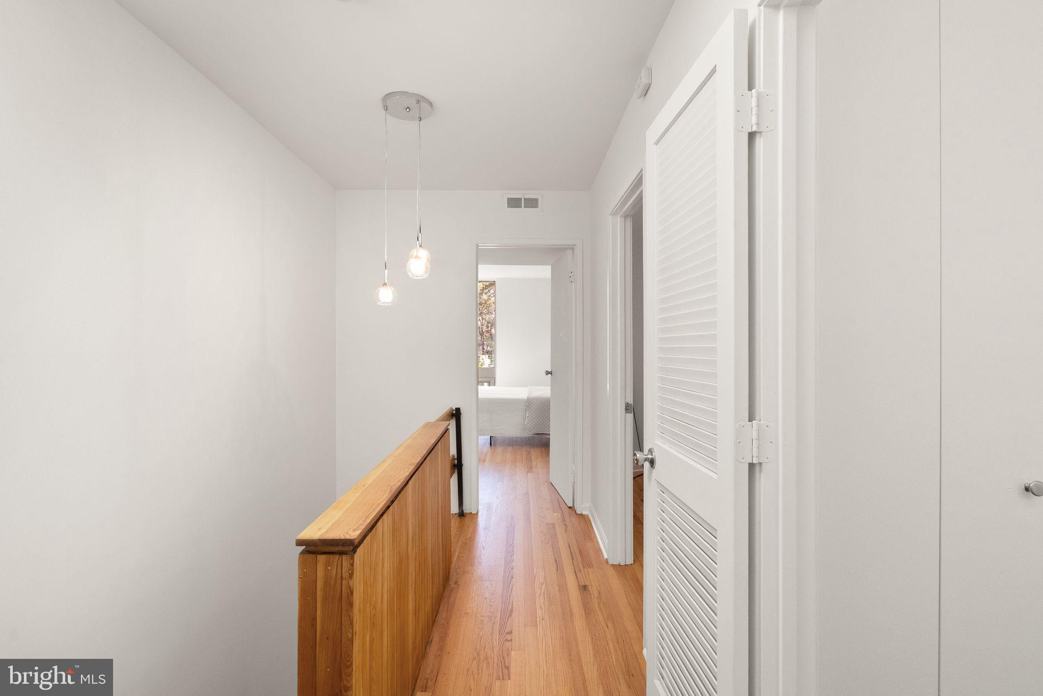 11577 Maple Ridge Road Reston, VA 20190 - Photo 29 of 48 a bathroom with a toilet and a walk in closet