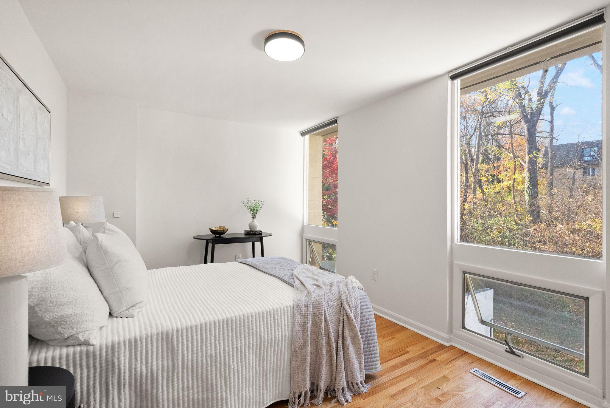 11577 Maple Ridge Road Reston, VA 20190 - Photo 31 of 48 a bedroom with a bed and a window